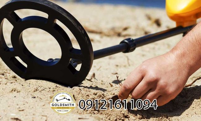 A metal detector with a metal rod Description automatically generated