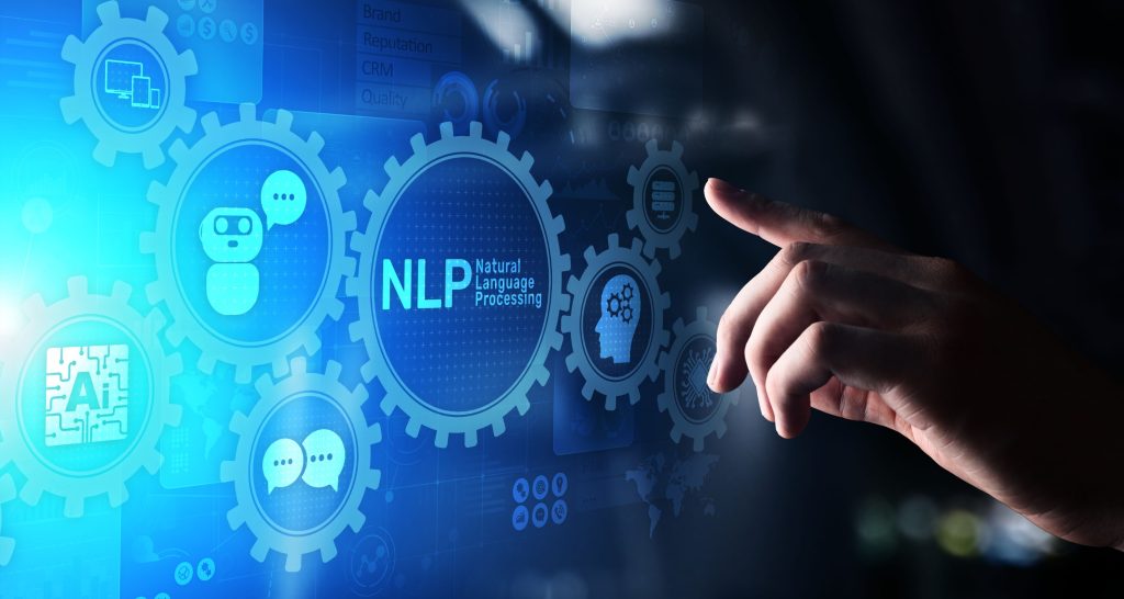 پردازش زبان طبیعی چیست؟ بازدید کامل مفاهیم و کاربردهای NLP_سیاه پوش 11 دست یک شخص در حال لمس تصویر اسکریم که ر روی آن نوشته شده nlp